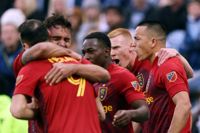 Real Salt Lake's Bobby Wood is congratulated by teammates after scoring the injury-time winner in a 2-1 MLS Cup playoff win over Sporting Kansas City