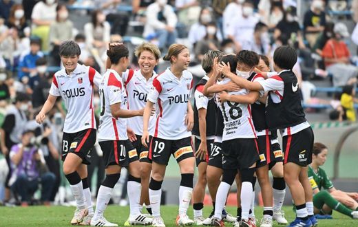 Urawa Reds Ladies' players celebrate their victory after the WE League football match against Tokyo Verdy Beleza in Tokyo on September 12, 2021.