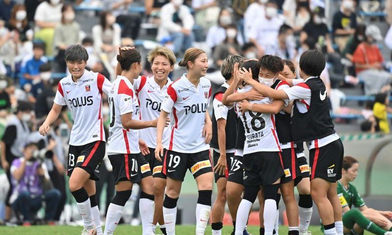 Urawa Reds Ladies' players celebrate their victory after the WE League football match against Tokyo Verdy Beleza in Tokyo on September 12, 2021.