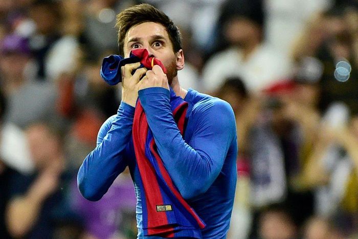 Iconic: Lionel Messi kisses his jersey after celebrating his last-minute goal against Real Madrid in 2017