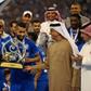FIFA President Gianni Infantino (left) presents the trophy to Al Hilal midfielder Salman Al-Faraj