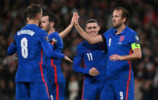 England striker Harry Kane (R) celebrates after scoring against Albania