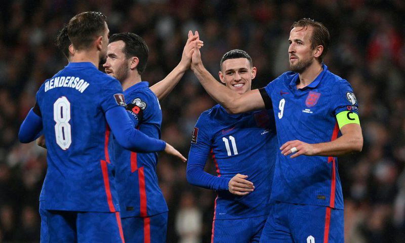 England striker Harry Kane (R) celebrates after scoring against Albania
