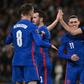 England striker Harry Kane (R) celebrates after scoring against Albania