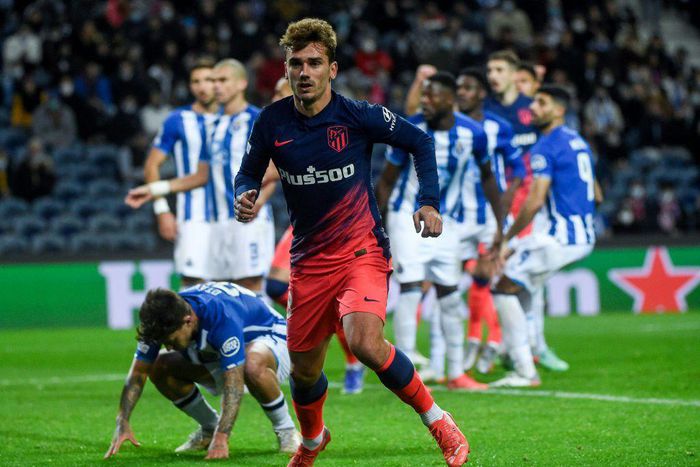 Antoine Griezmann got the opener as Atletico Madrid beat Porto to qualify for the Champions League last 16