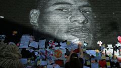 Messages of support adorn a mural of Manchester United and England forward Marcus Rashford after it was defaced