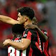Nadiem Amiri (R) celebrates scoring Leverkusen's fourth goal on Saturday