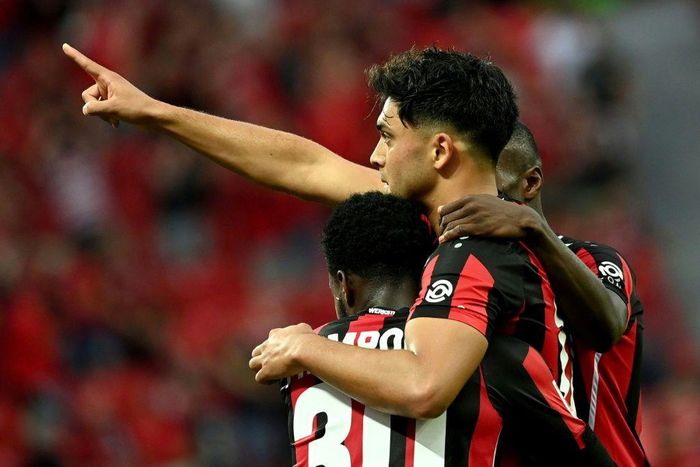 Nadiem Amiri (R) celebrates scoring Leverkusen's fourth goal on Saturday