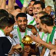Captain Riyad Mahrez (C) holds the Africa Cup of Nations trophy after Algeria defeated Senegal in the 2019 final in Cairo