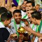 Captain Riyad Mahrez (C) holds the Africa Cup of Nations trophy after Algeria defeated Senegal in the 2019 final in Cairo