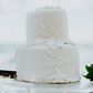 A couple cuts their wedding cake.