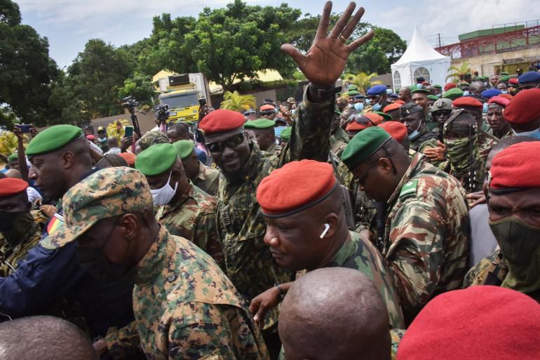 Coup leader Mamady Doumbouya (Hand raised)