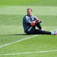 Germany goalkeeper Manuel Neuer warms up before Sunday's session in Herzogenaurach