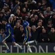 Chelsea midfielder Jorginho (L) celebrates after scoring against Leeds