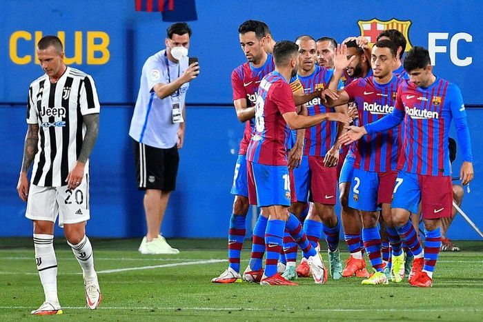 On target: Barcelona players celebrate their second goal during the Joan Gamper Trophy against Juventus at the Johan Cruyff Stadium