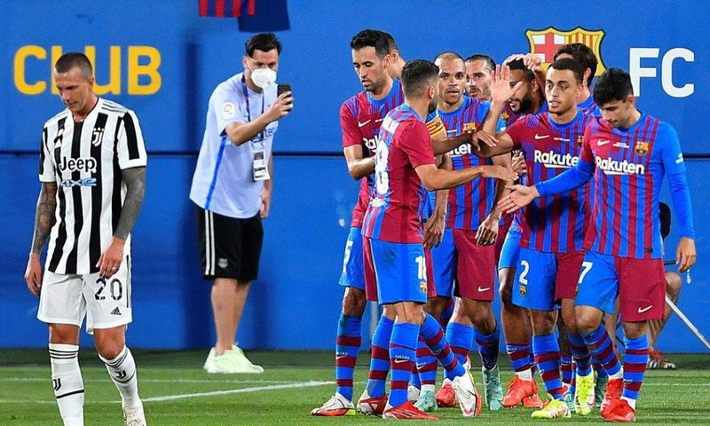 On target: Barcelona players celebrate their second goal during the Joan Gamper Trophy against Juventus at the Johan Cruyff Stadium