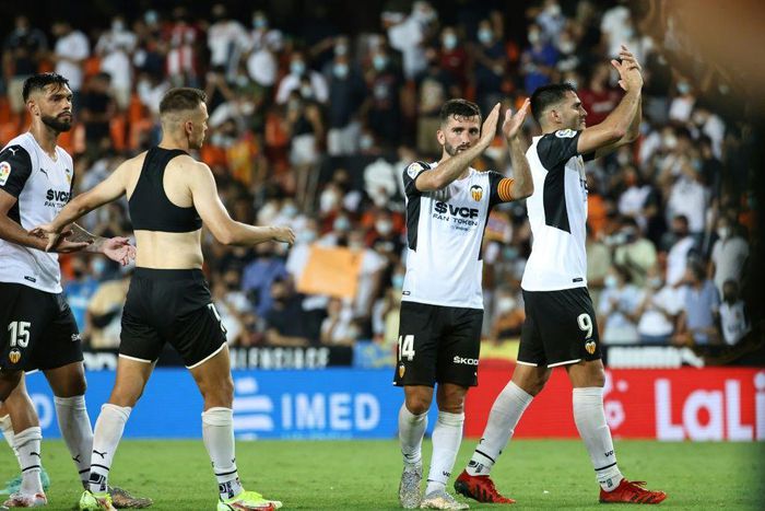 Winning start: Valencia's players celebrate