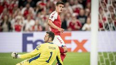 Denmark's Joakim Maehle scores against Scotland