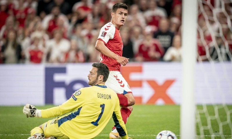 Denmark's Joakim Maehle scores against Scotland