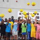 Kojo Afari tutoring the athletes in some basic basketball techniques