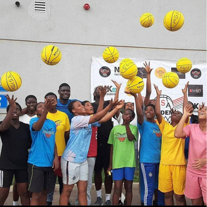 Kojo Afari tutoring the athletes in some basic basketball techniques