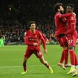 Divock Origi (right) scored in stoppage time to take Liverpool top of the Premier League