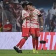 Leipzig midfielder Dominik Szoboszlai (R) celebrates after scoring twice in the rout of Stuttgart