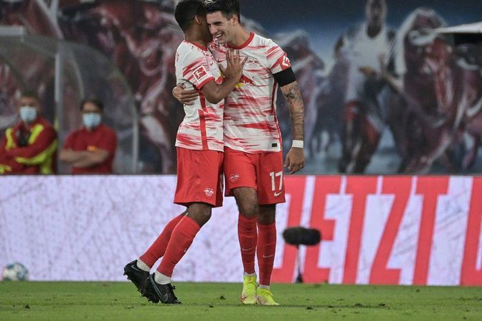 Leipzig midfielder Dominik Szoboszlai (R) celebrates after scoring twice in the rout of Stuttgart