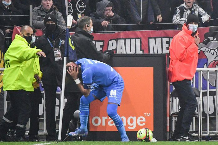 Marseille's Dimitri Payet was struck on the head by a bottle of water thrown from the crowd as he went to take a corner in the Ligue 1 game against Lyon last month