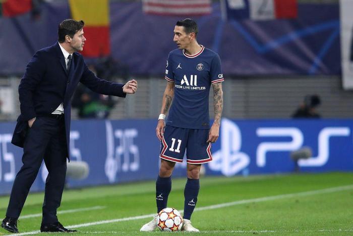 PSG coach Mauricio Pochettino with Angel di Maria during Wednesday's Champions League game against Leipzig