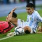 Argentina's Carlos Valenzuela (R) competes for the ball with South Korea's Um Won-sang (L) during their friendly football match in Yongin, South Korea
