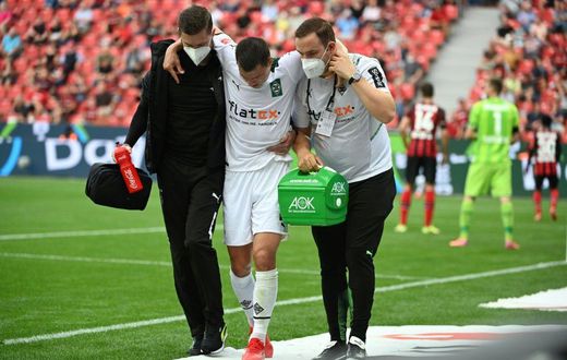 Moenchengladbach defender Stefan Lainer (C) suffered a broken leg in the defeat at Bayer Leverkusen