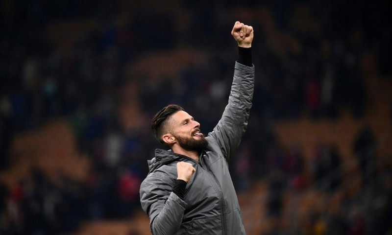 Reaching for the top: Olivier Giroud celebrating victory over Torino