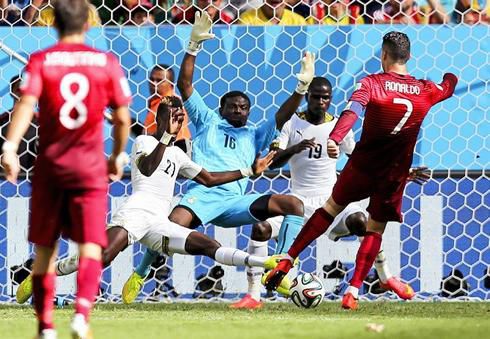 Fatau Dauda attempting to save a shot from Cristiano Ronaldo