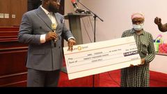 Ama Forson receiving a donation of GHC20,000 from Chief Executive Officer of KAB FAM Ghana Limited, Kwaku Antwi Boahen.