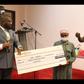 Ama Forson receiving a donation of GHC20,000 from Chief Executive Officer of KAB FAM Ghana Limited, Kwaku Antwi Boahen.