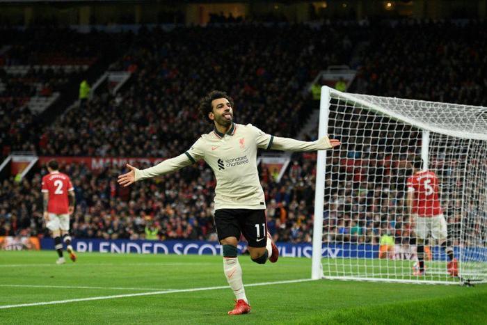 Mohamed Salah celebrates after scoring Liverpool's fifth goal, and his third, at Old Trafford