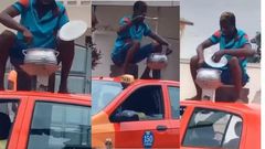 Ghanaian man cooks with coalpot on top of moving taxi while sitting on kitchen stool (video)