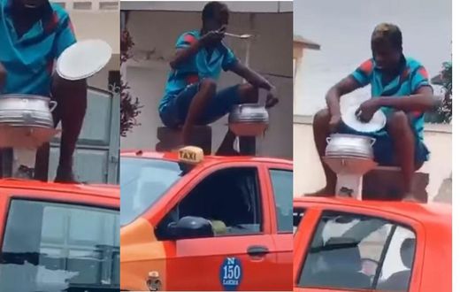 Ghanaian man cooks with coalpot on top of moving taxi while sitting on kitchen stool (video)