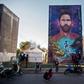 Someone to look up to: a mural of Lionel Messi looms over the playground of his former school