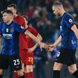 Inter Milan striker Edin Dzeko (R) refused to celebrate after scoring against his former side Roma