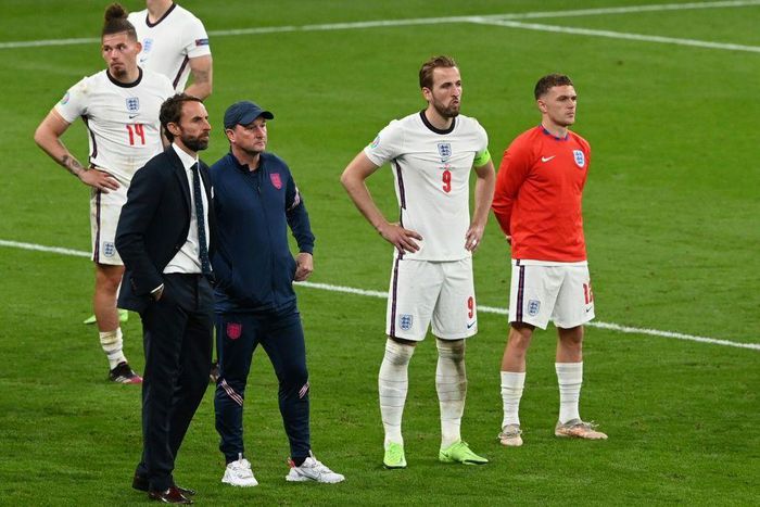 England manager Gareth Southgate (L) and his players after the Euro 2020 final