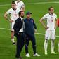 England manager Gareth Southgate (L) and his players after the Euro 2020 final