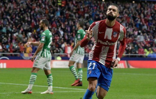 Yannick Carrasco celebrates giving Atletico Madrid the lead against Real Betis
