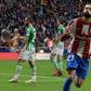 Yannick Carrasco celebrates giving Atletico Madrid the lead against Real Betis