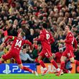 Jordan Henderson (left) celebrates scoring Liverpool's winner against AC Milan