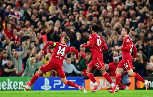 Jordan Henderson (left) celebrates scoring Liverpool's winner against AC Milan
