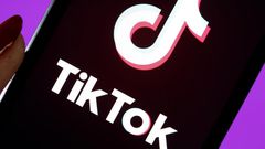 The social media application logo, Tik Tok is displayed on the screen of an iPhone.