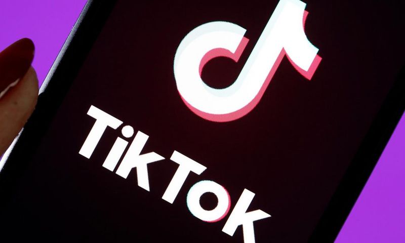 The social media application logo, Tik Tok is displayed on the screen of an iPhone.