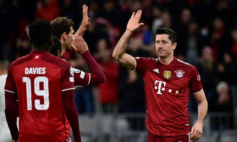 Robert Lewandowski (R) celebrates his early goal for Bayern Munich, but later had a weak penalty attempt saved